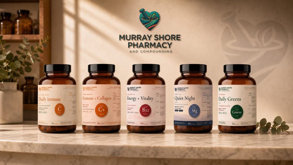 The Murray Shore Pharmacy identity in place: the heart-and-mortar mark on the wall and the labelled amber bottles lined up beneath it